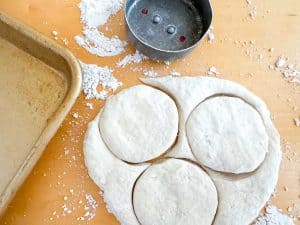 3 biscuits cut out of dough for a small batch of biscuits.