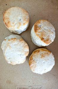 Baked biscuits on a baking sheet.