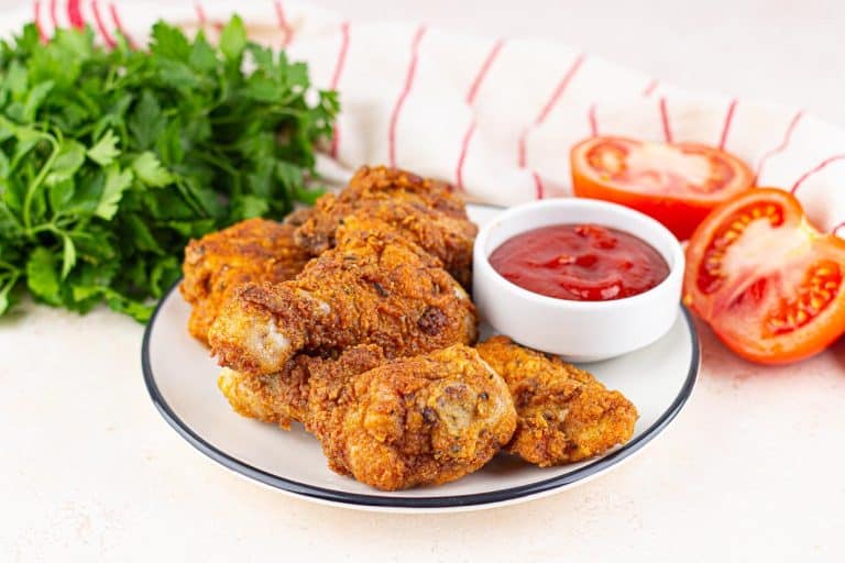 Copy-cat KFC fried chicken on a plate served with a ketchup.