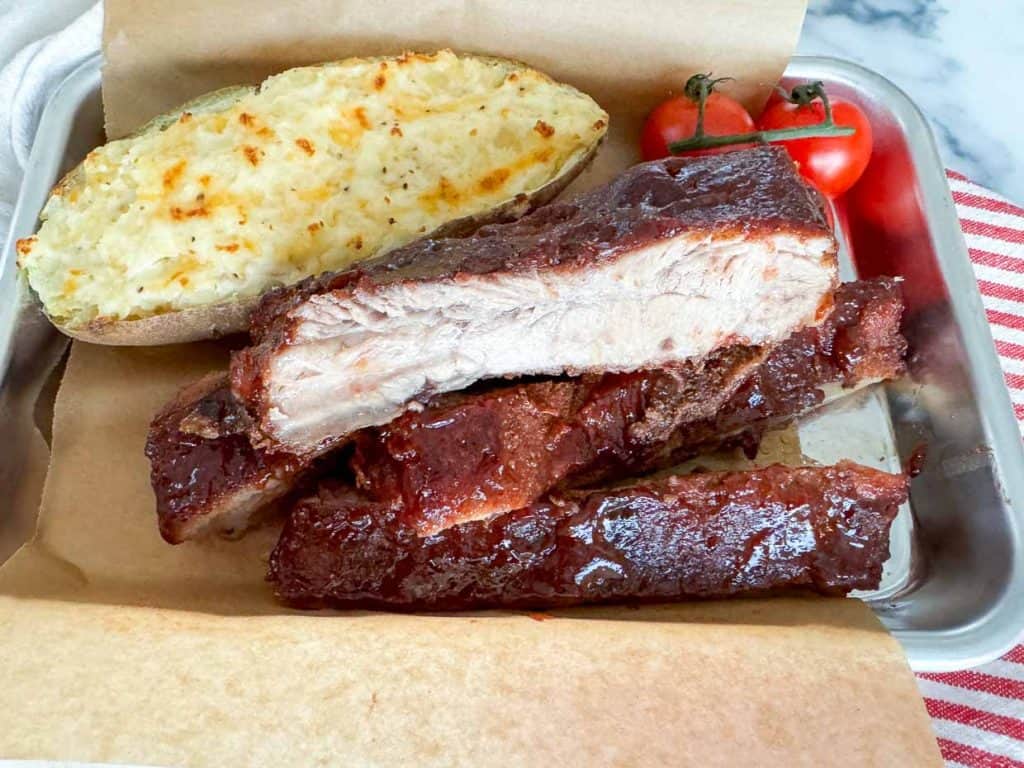 Rib dinner on a small baking sheet.