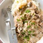 Smothered Pork chops over mashed potatoes.