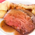 Beef with gravy and yorkshire pudding.