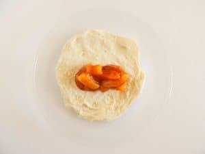 Pie filling on biscuit dough.