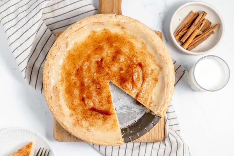 Sugar cream pie with a slice missing.