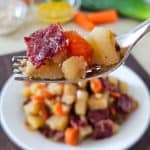A forkful of slow cooker corned beef hash.
