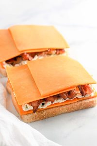 Extra cheddar cheese placed over the bacon.