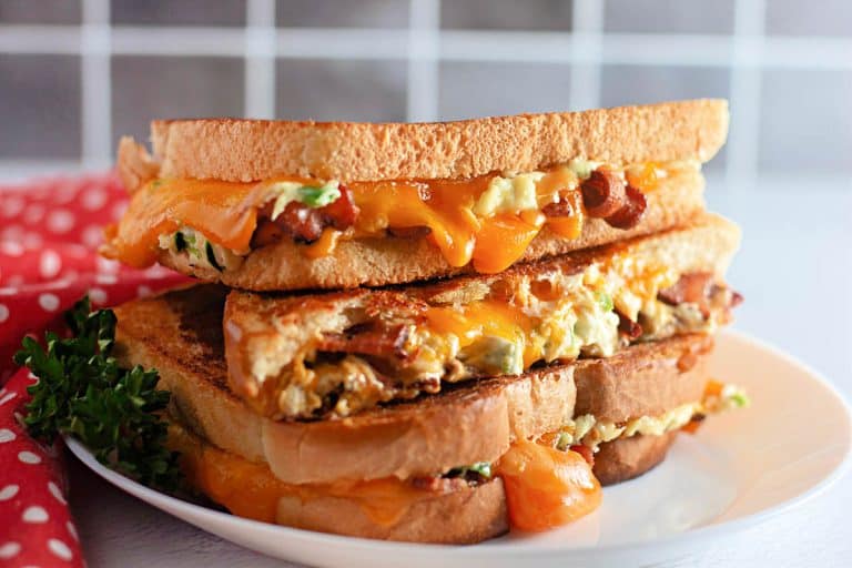 Stacked Jalapeño Popper Grilled Cheese on a white plate.