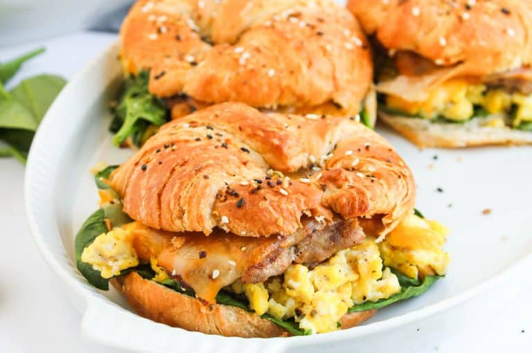 Zoomed-in shot of filled croissant breakfast sandwich.