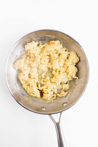 Scrambled eggs in skillet.