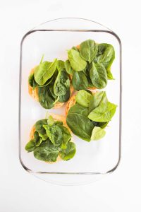 Croissants topped with spinach.