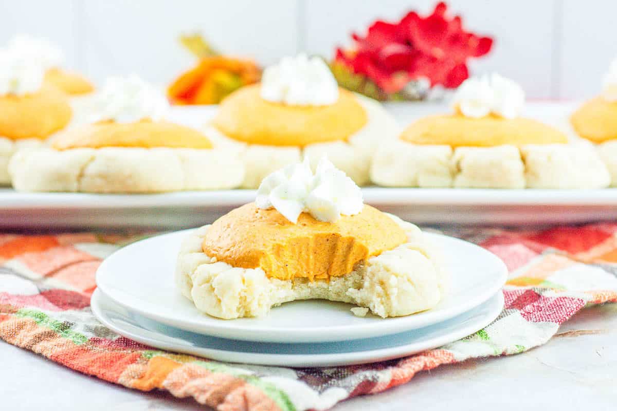 Close-up of pumpkin pie cookies on a white platter.