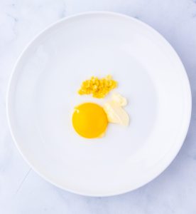 Egg yolk, garlic, and mayonnaise mixture for ramen.